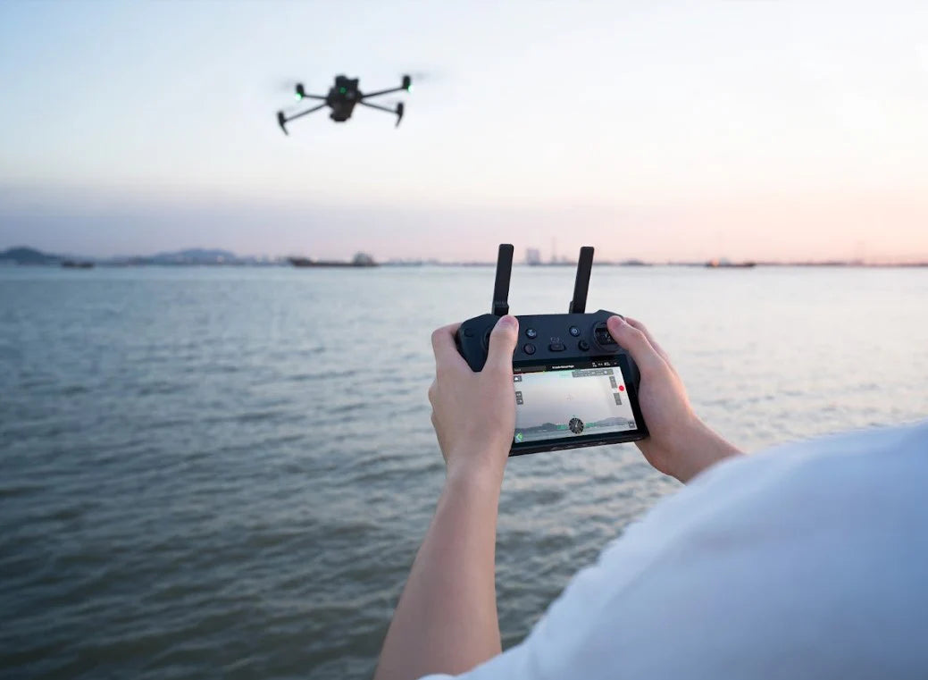 Person controlling DJI Mavic 3 Enterprise Drone with a remote control