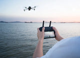 Person controlling DJI Mavic 3 Enterprise Drone with a remote control